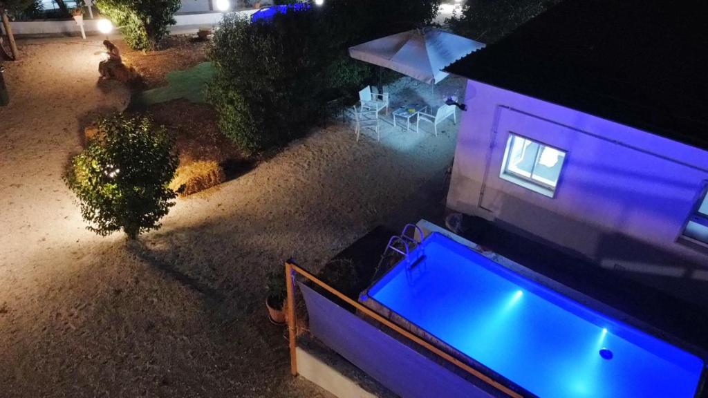 an overhead view of a house with a swimming pool at La casetta in Martina Franca