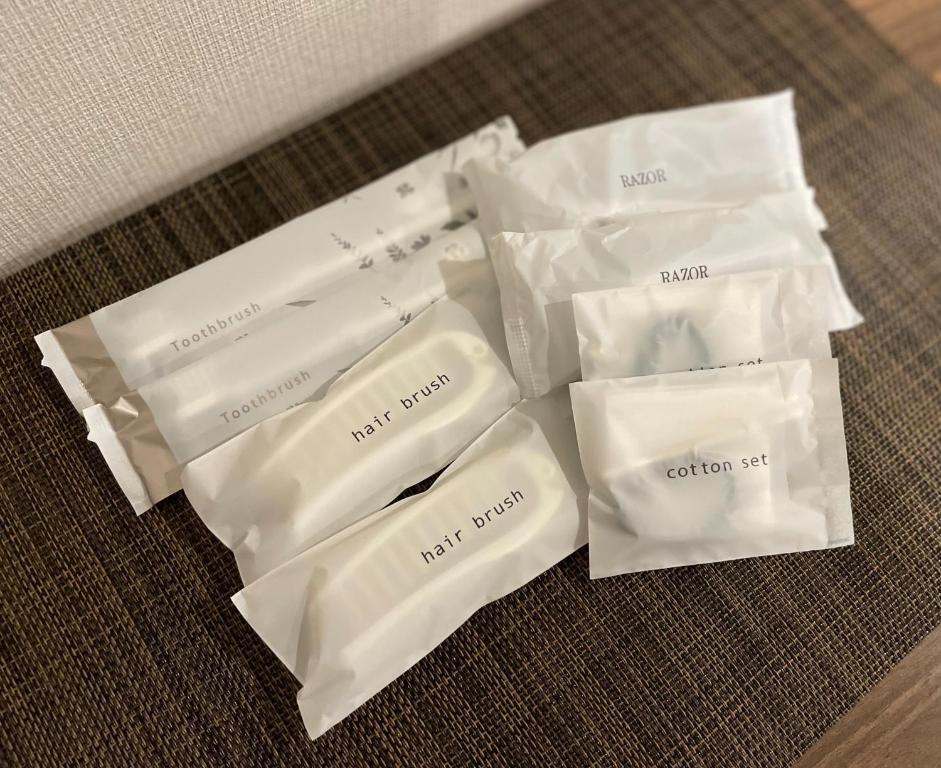 a group of white envelopes sitting on a table at T-HOTEL Iriya - Vacation STAY 94122v in Tokyo