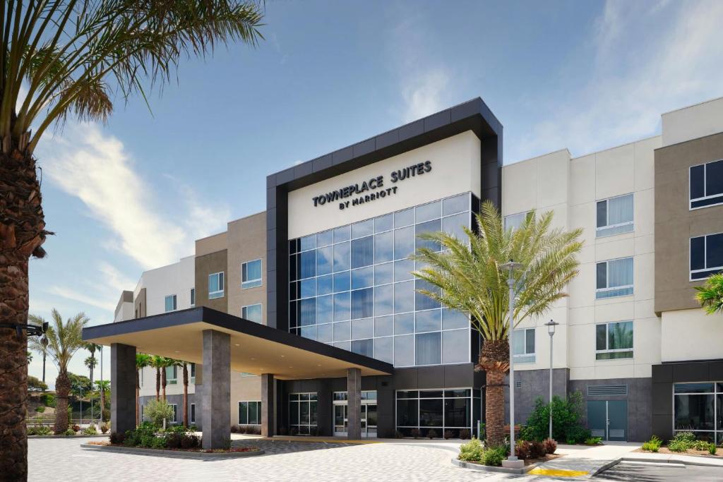 an office building with palm trees in front of it at TownePlace Suites by Marriott Ventura Oxnard in Oxnard