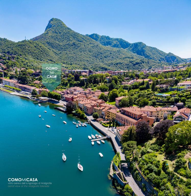 an aerial view of a town with boats in the water at COMO mi CASA in Malgrate
