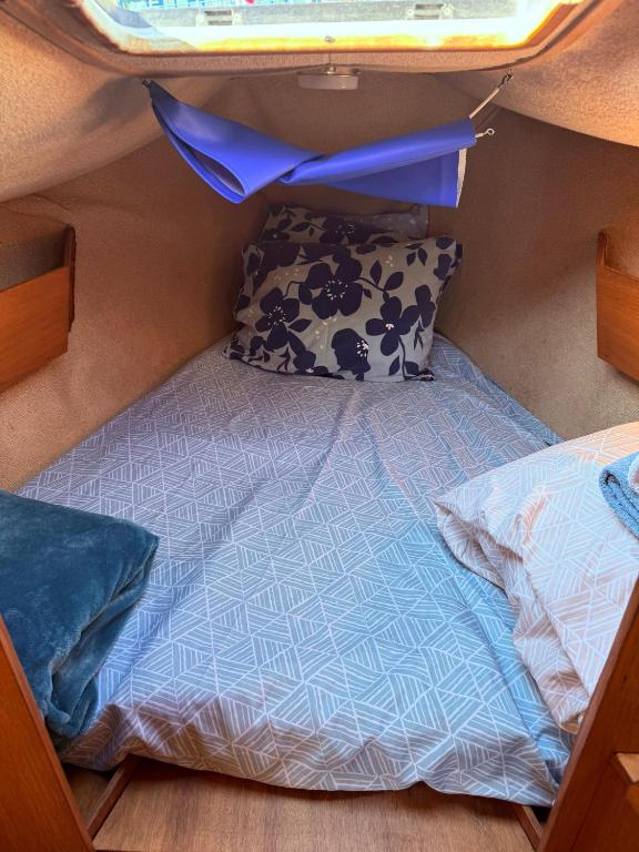 a bed in the back of a rv with a pillow at Lisboa Minuano Oriente in Lisbon
