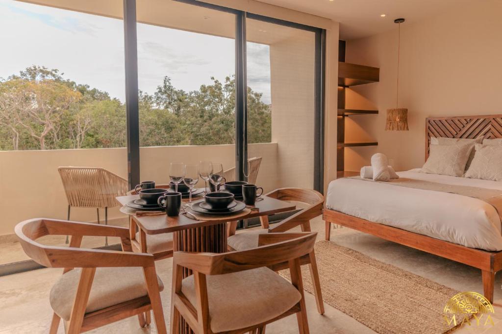 Ένα ή περισσότερα κρεβάτια σε δωμάτιο στο Peregrina Tulum Lux Aparthotel