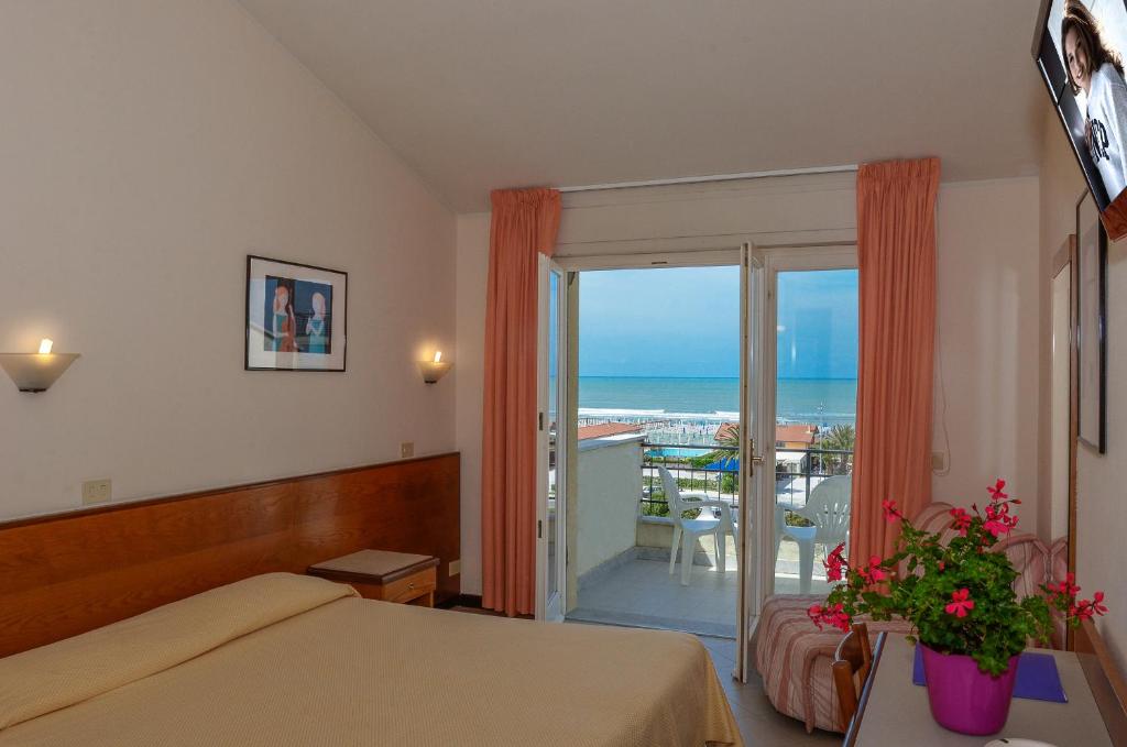 Postel nebo postele na pokoji v ubytování Hotel Montecarlo