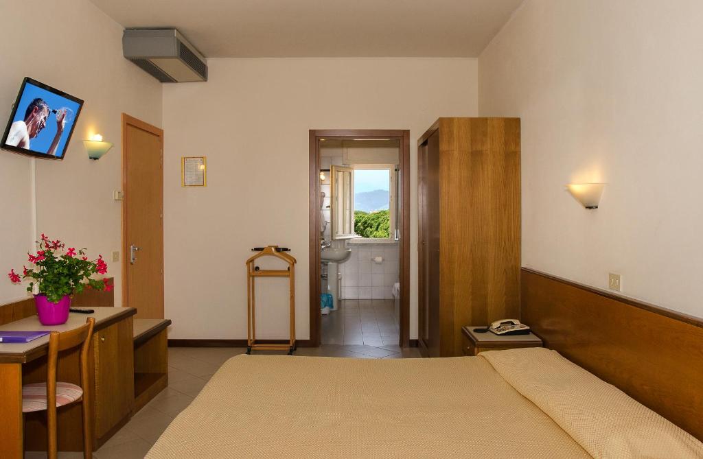 Postel nebo postele na pokoji v ubytování Hotel Montecarlo
