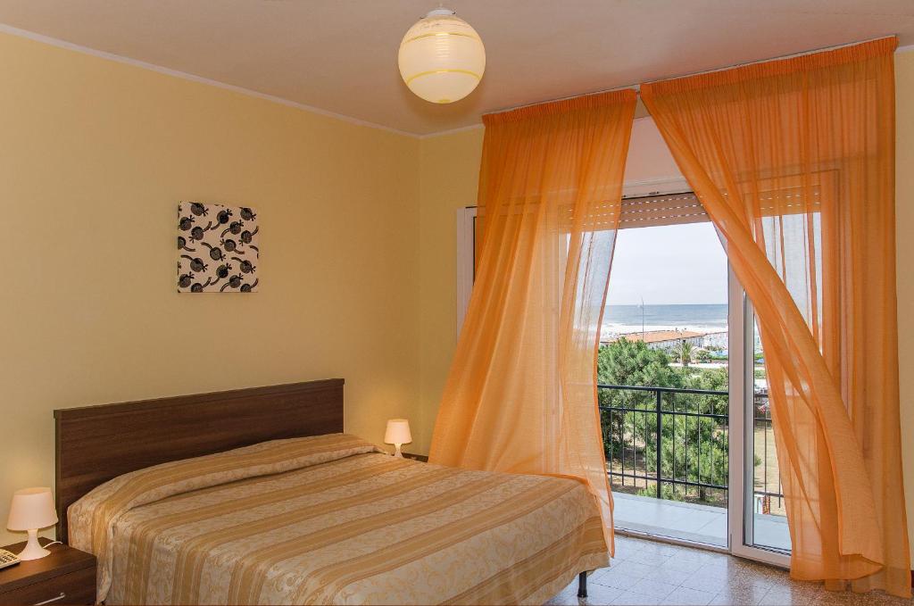 Postel nebo postele na pokoji v ubytování Hotel Montecarlo