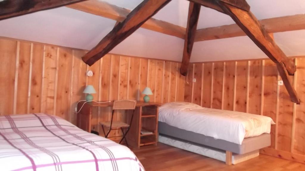 Postel nebo postele na pokoji v ubytování Le Mas De La Siffleuse