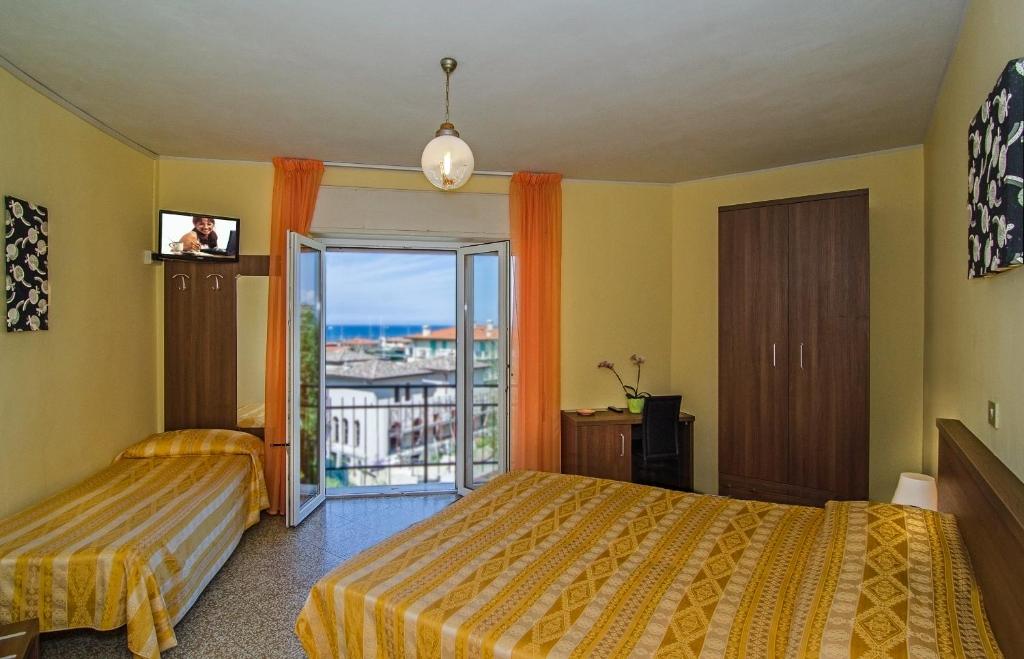 Postel nebo postele na pokoji v ubytování Hotel Montecarlo