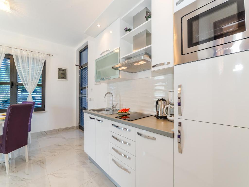 Kuchyň nebo kuchyňský kout v ubytování Apartments Dalmatia