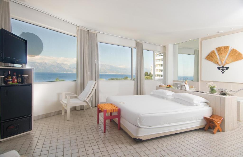 A bed or beds in a room at The Marmara Antalya