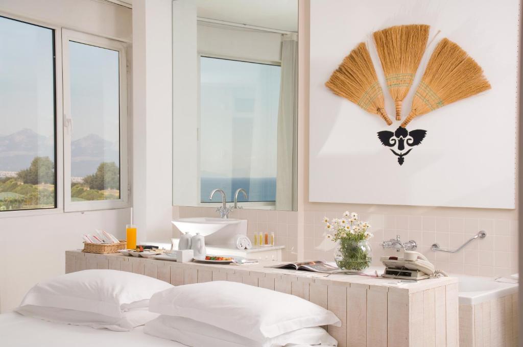 A bed or beds in a room at The Marmara Antalya