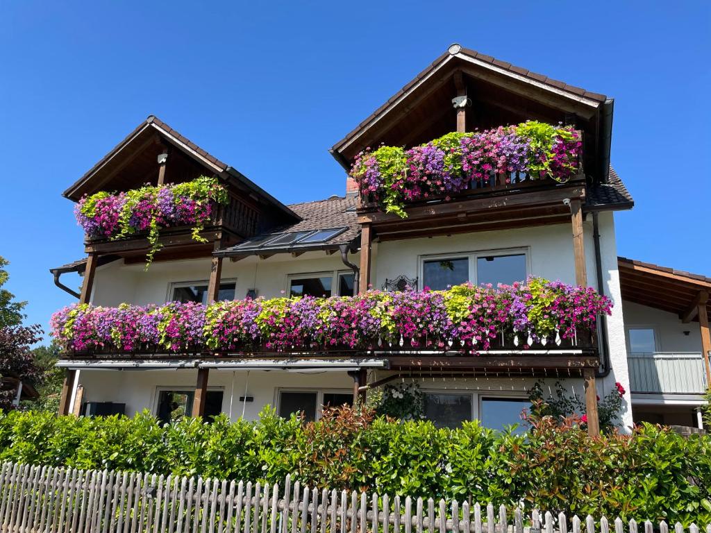 a house with flowers on the balconies at Bergblick in Weilheim in Oberbayern