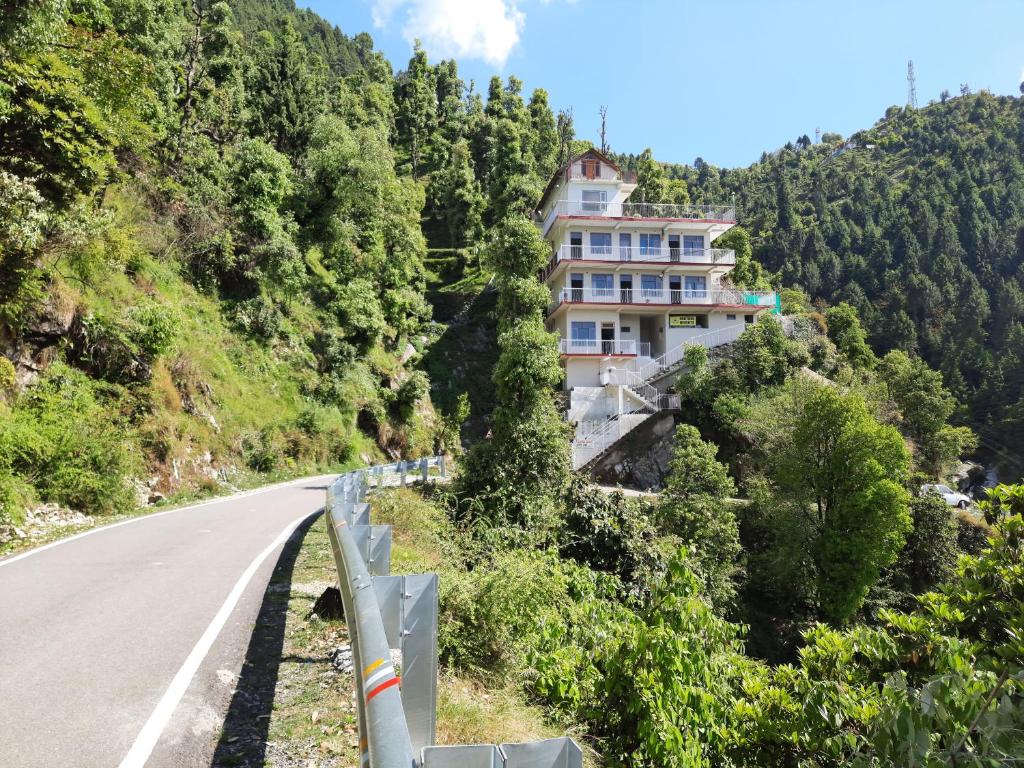 a house on the side of a mountain at FORTUNE HEIGHTS DALHOUSiE in Dalhousie