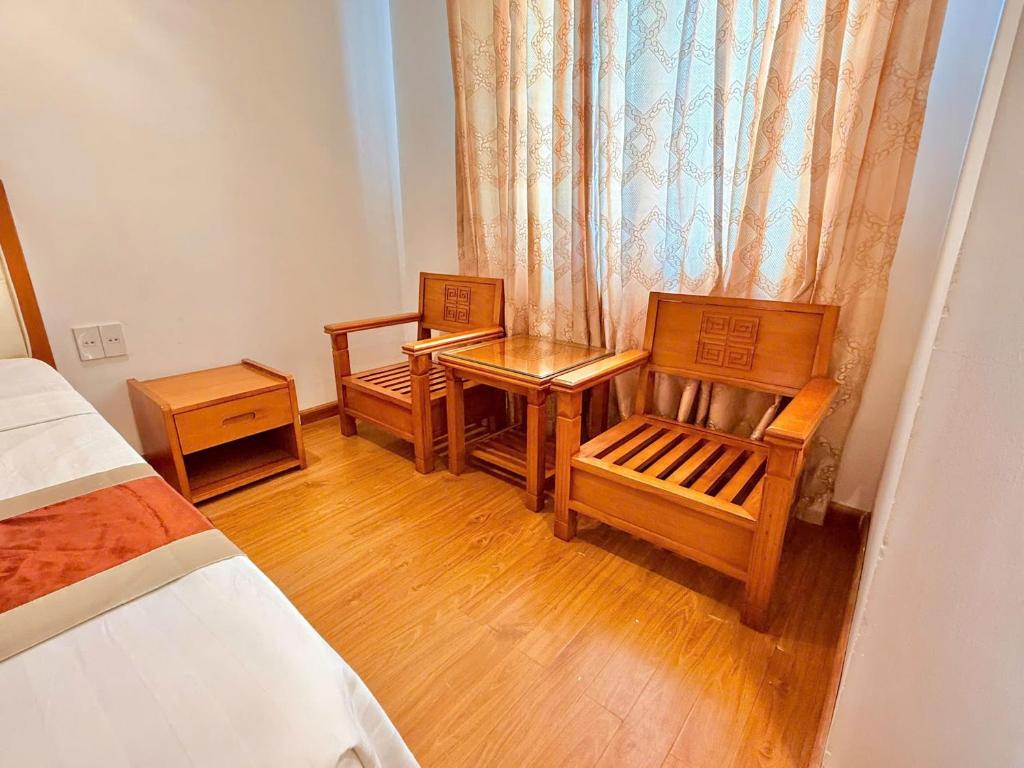 Giường trong phòng chung tại Khách sạn Golden Beach Nha Trang