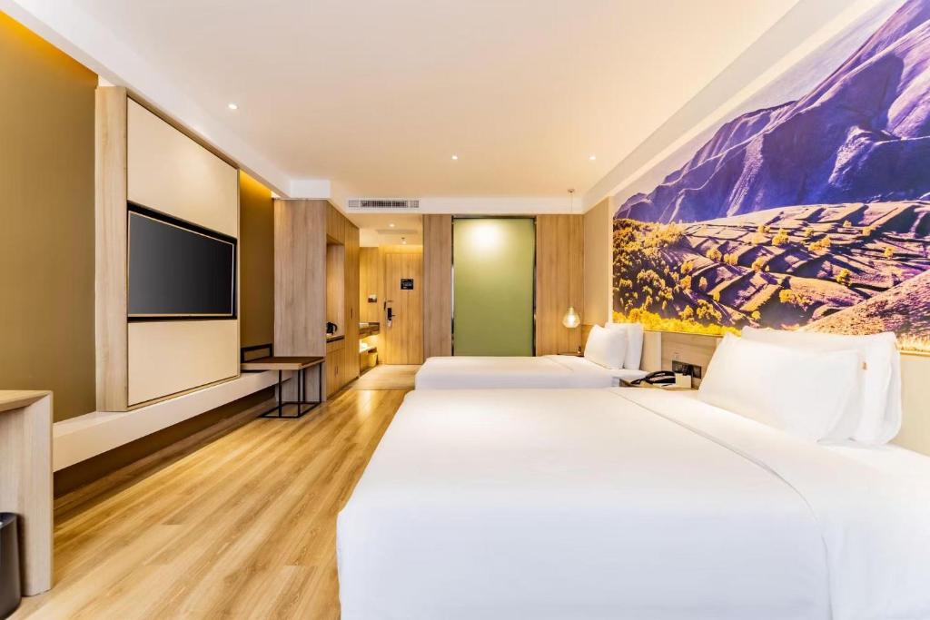 Postel nebo postele na pokoji v ubytování Atour Hotel Hohhot Yinhé South Street
