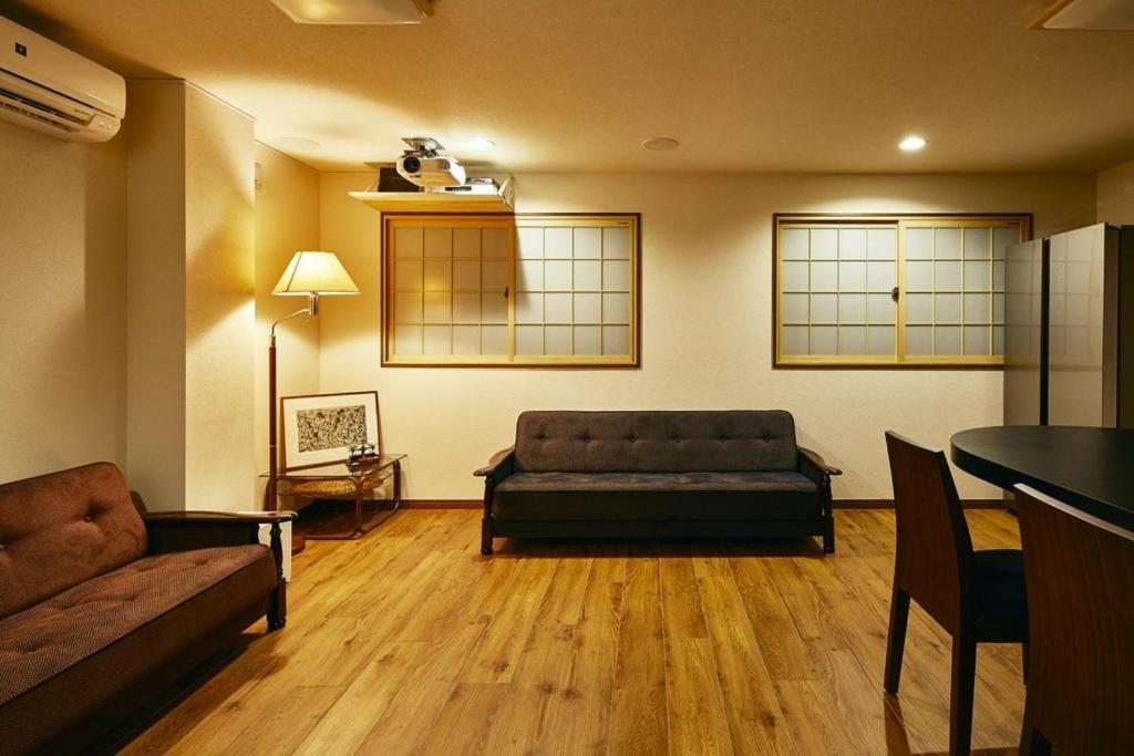 a living room with a couch and a table at 634 Condo Yotsuya - Vacation STAY 14799v in Tokyo