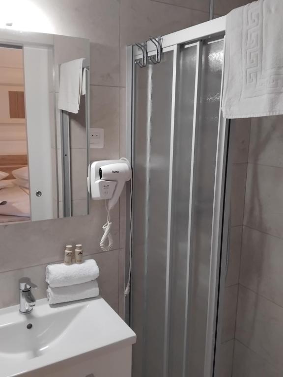 a bathroom with a shower and a sink at Apartments Adria in Jadrija