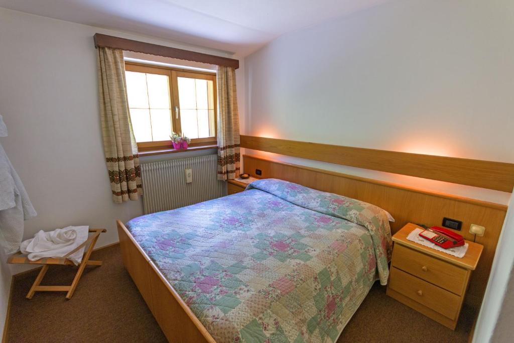 Postel nebo postele na pokoji v ubytování Hotel De Fronz