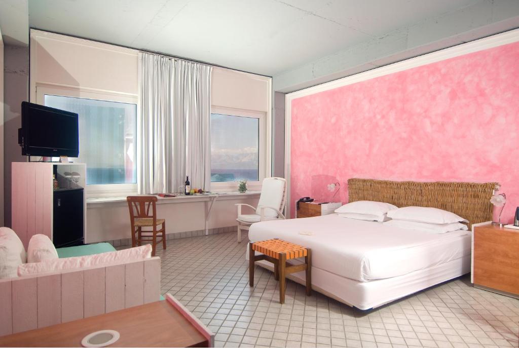 A bed or beds in a room at The Marmara Antalya