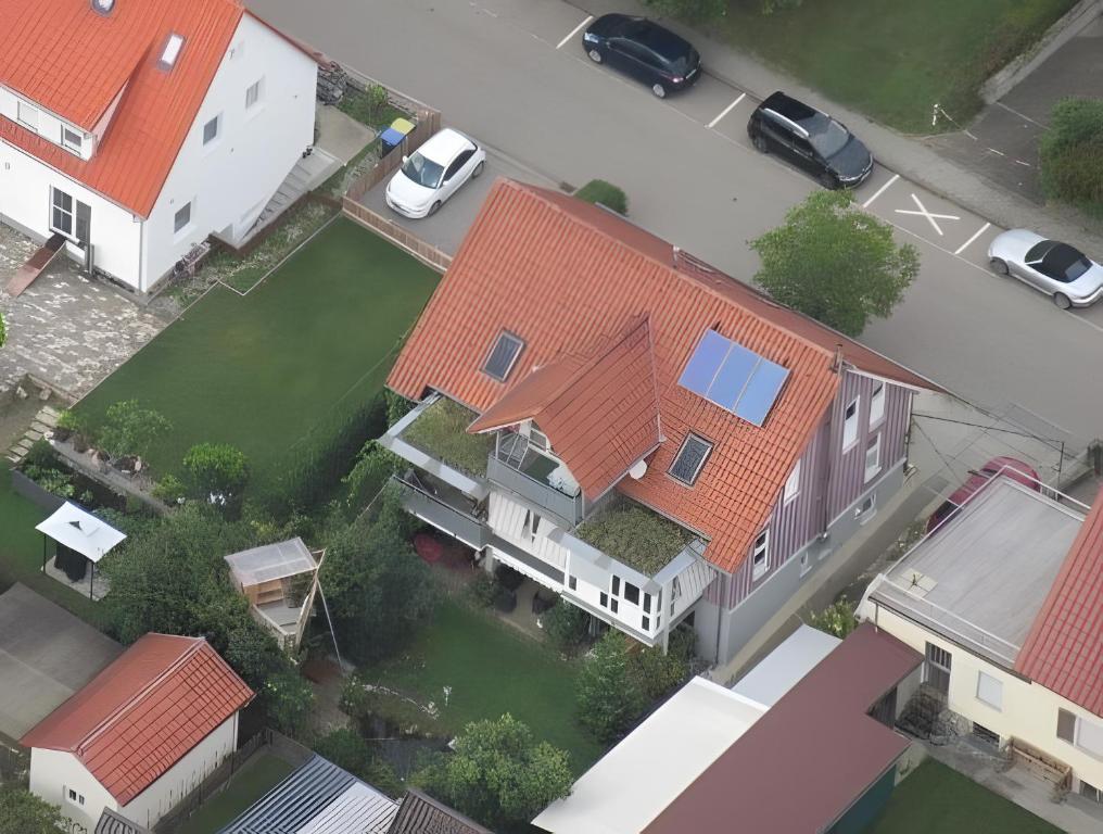an overhead view of a house with red roof at Ferienwohnung Stine in Stetten