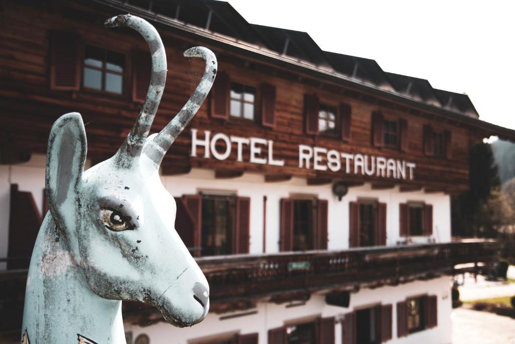 a statue of a goat in front of a hotel restaurant at BioHotel Bruggerhof in Kitzbühel
