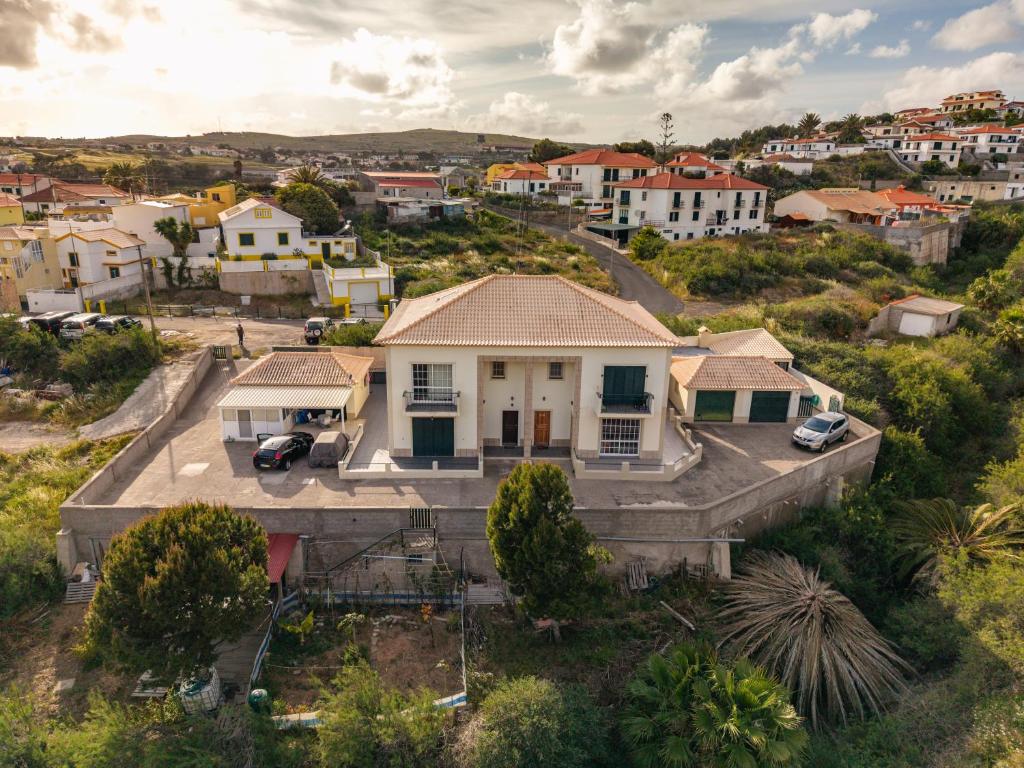 an aerial view of a house in a residential neighborhood at Simões Charm By HR Madeira in Vila Baleira