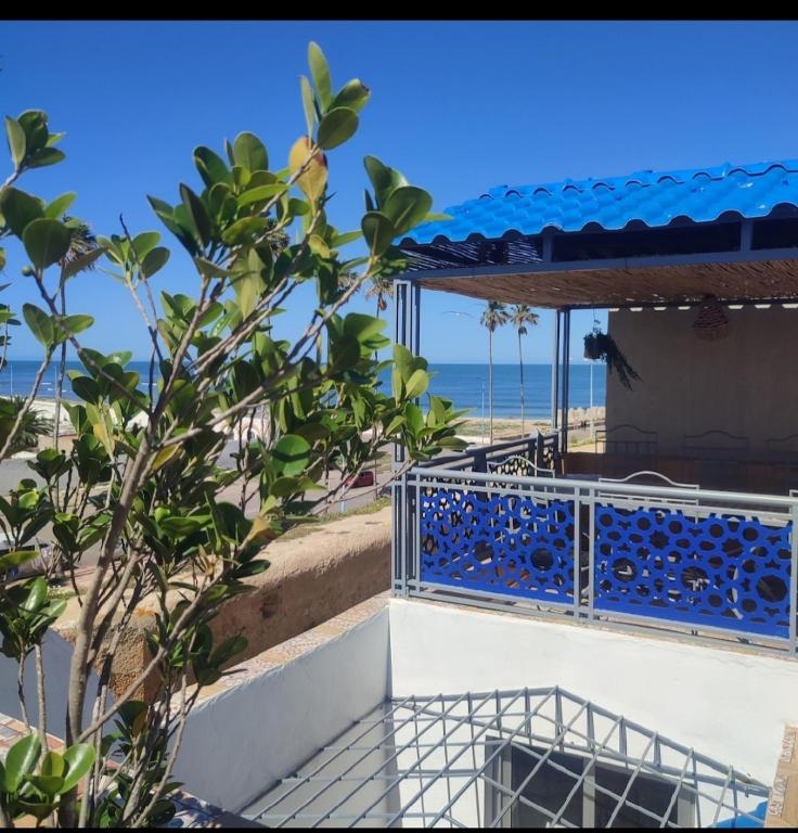 a view of the beach from the balcony of a house at riad la citadelle in El Jadida