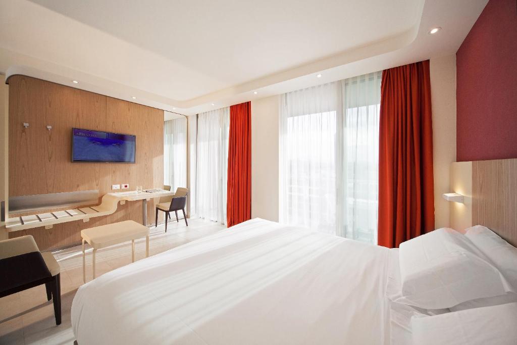 Postel nebo postele na pokoji v ubytování Hotel Aria
