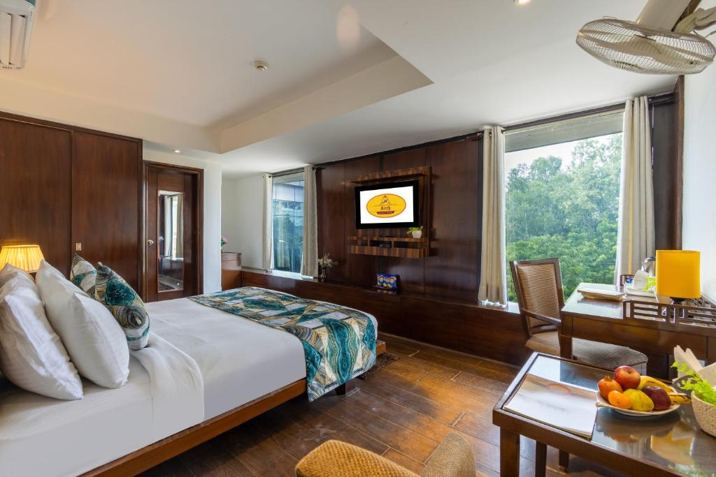 Ένα ή περισσότερα κρεβάτια σε δωμάτιο στο Arch Plaza - Near Yashobhoomi Convention Centre Dwarka