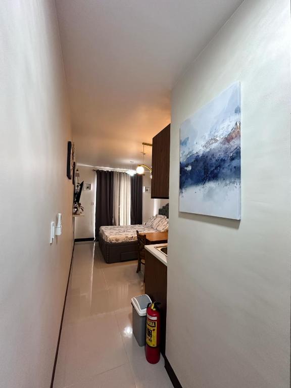 a small room with a bedroom and a bed in a room at J&A Arcadia in Lapu Lapu City