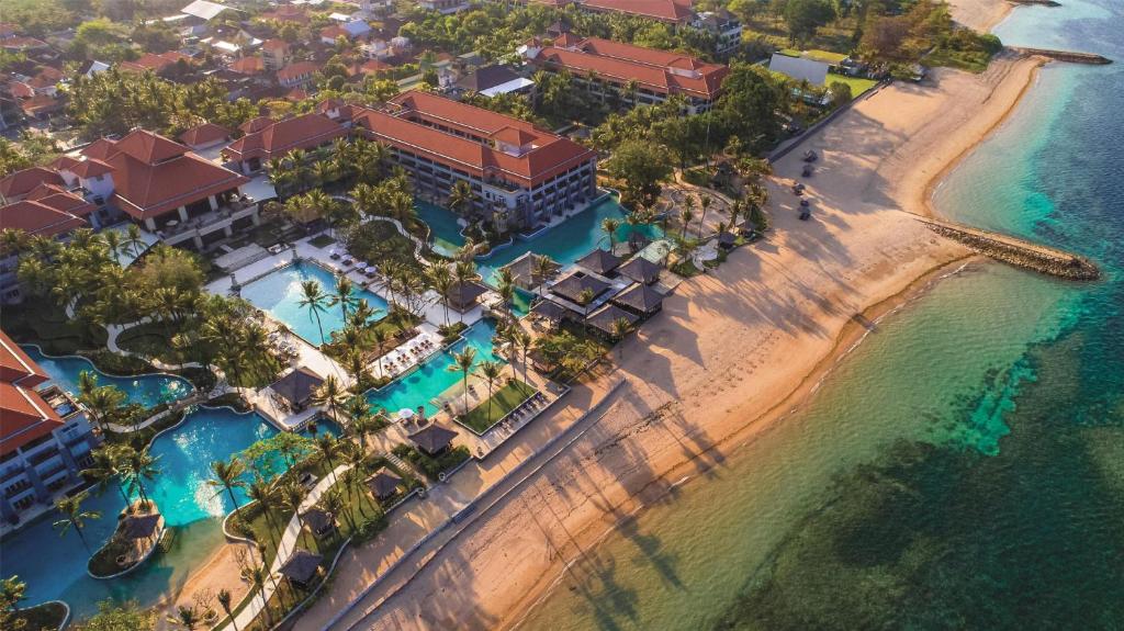 an aerial view of a resort on the beach at Conrad Bali in Nusa Dua