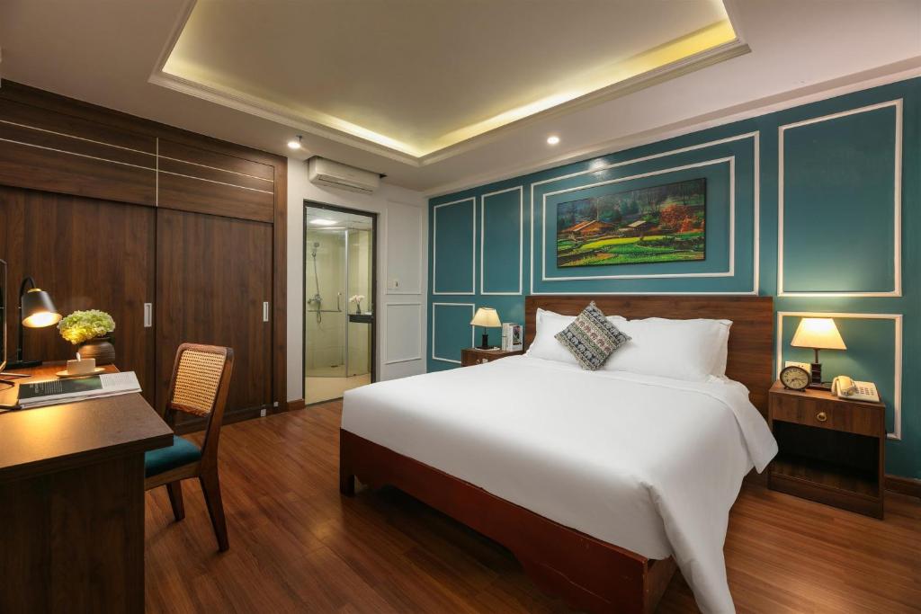 Giường trong phòng chung tại Glow Sapa Hotel