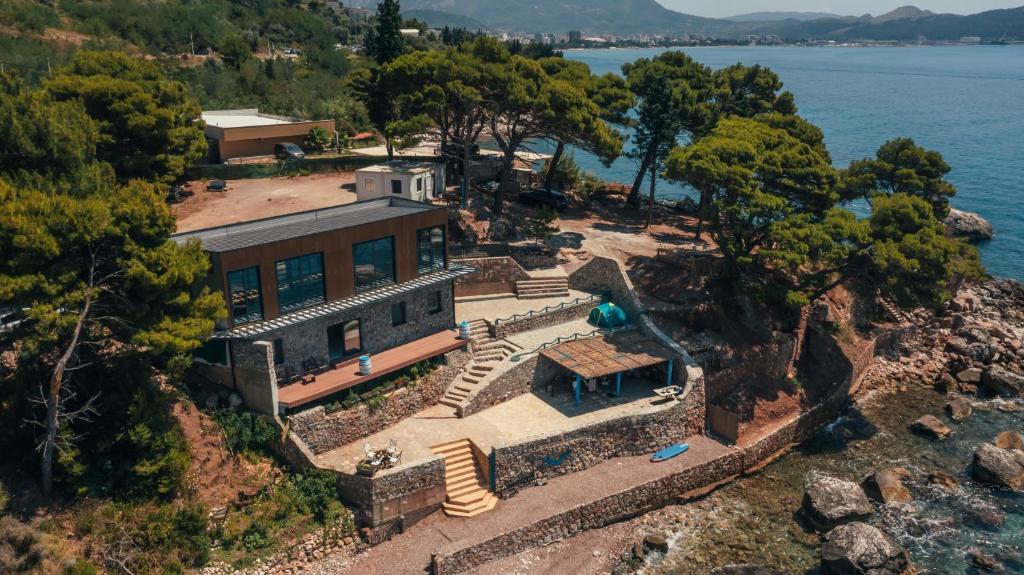 an aerial view of a house on the edge of the water at Art residence villa in Bar