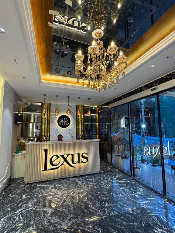 a store with a sign on the floor of a building at Hotel Lexus in New Delhi
