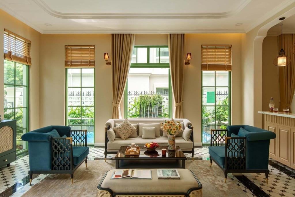 a living room with a couch and two chairs at Sea Gallery Tropical Villa Private Pool Khem Beach Phu Quoc in Phu Quoc