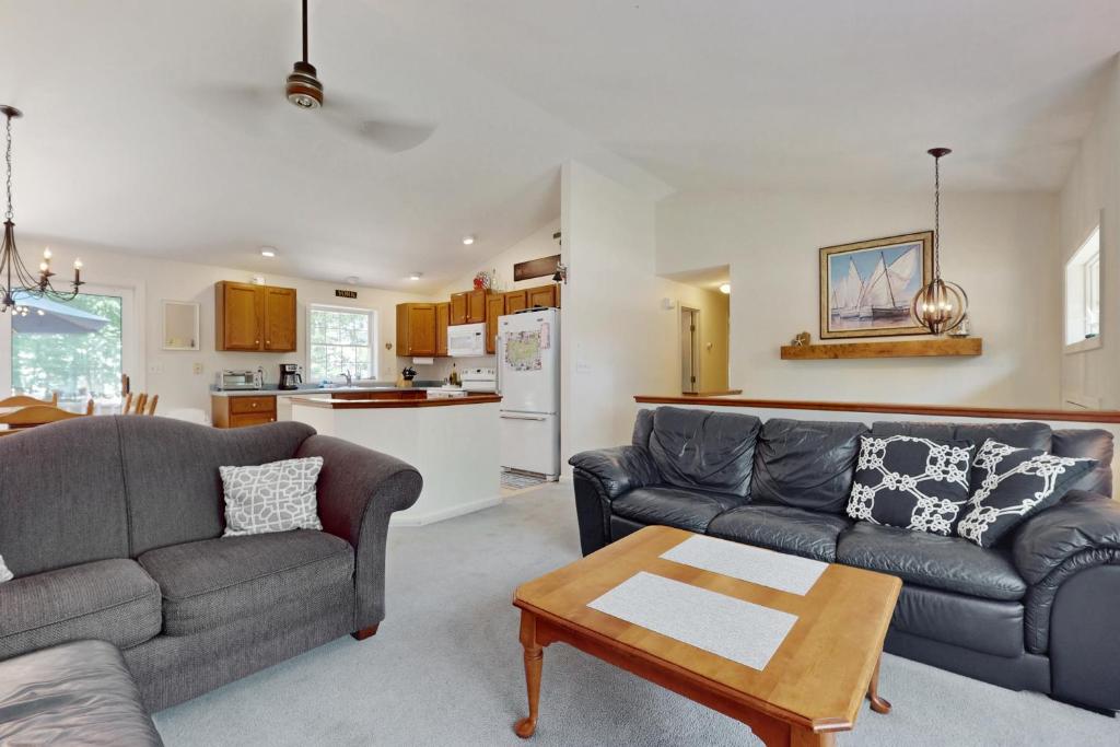 a living room with two couches and a table at The Lucky Lobster in York