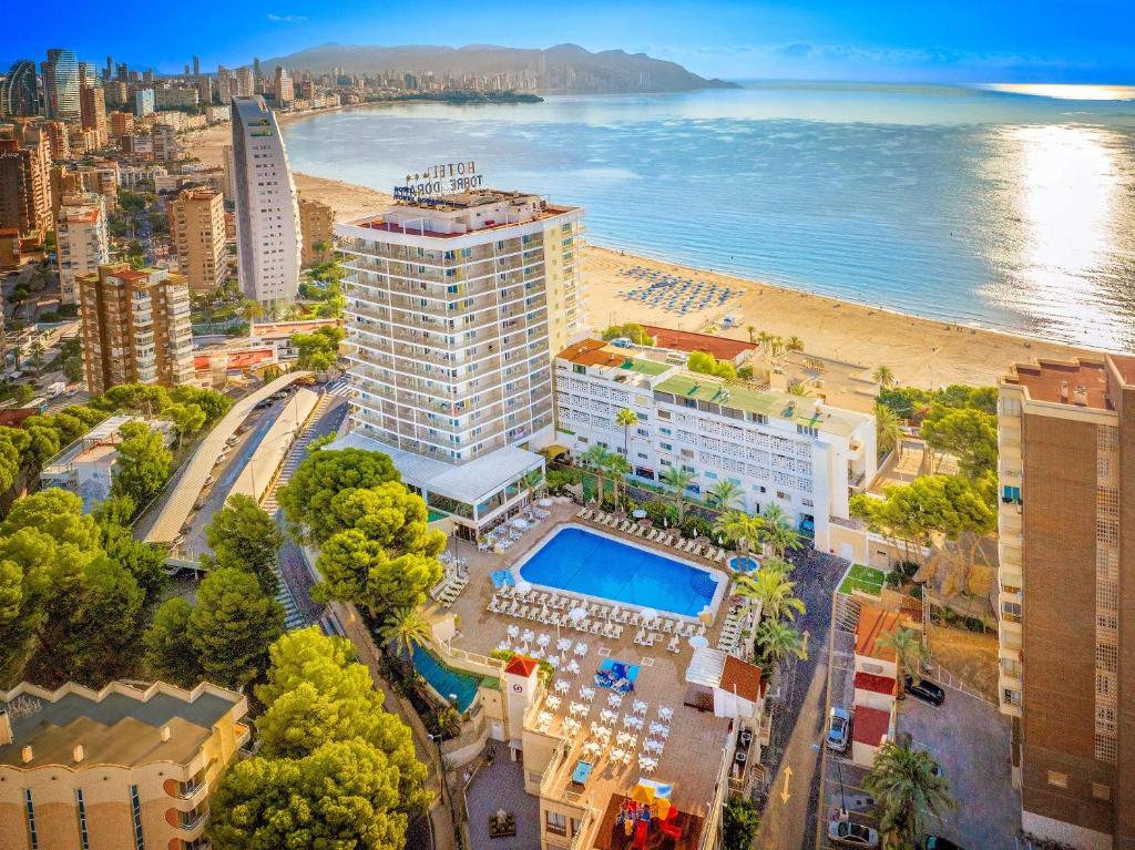 an aerial view of a city with a beach and buildings at Hotel Servigroup Torre Dorada in Benidorm