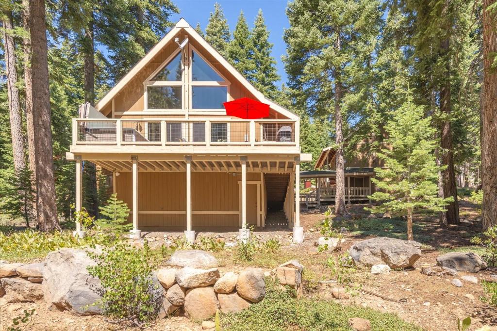 a house in the woods with a red roof at Jester Court home in Tahoe Vista