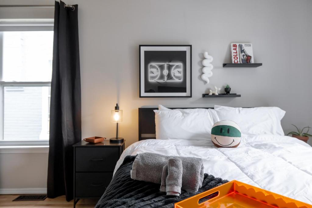 a bedroom with a bed with a toy on it at Arch City Escape in Saint Louis