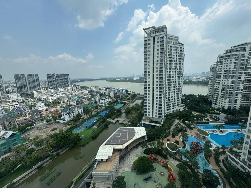 a view of a city with a river and buildings at Căn hộ cao cấp Diamond Island Luxury Apartment in Ho Chi Minh City
