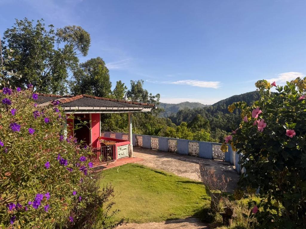 a view of a house with a garden at Pink House Ella in Ella