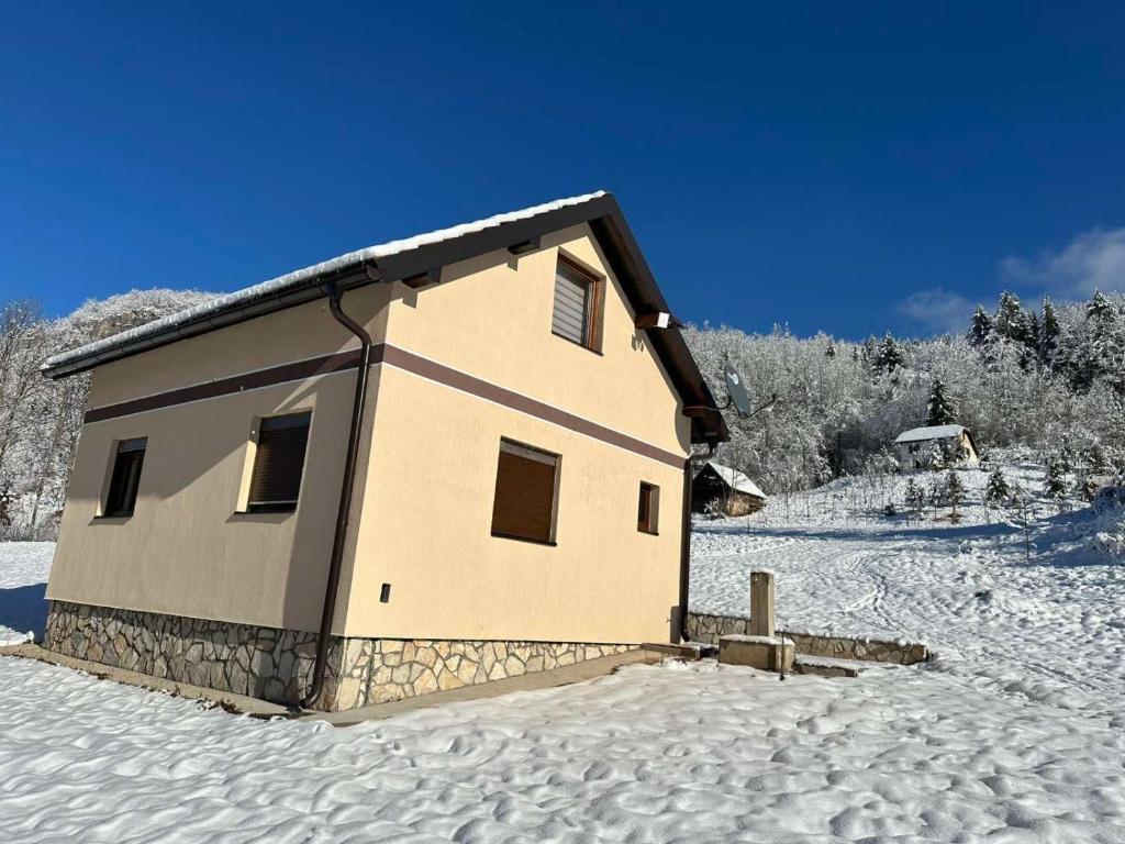 a small house in the snow in the snow at Silence of the Forest in Foča
