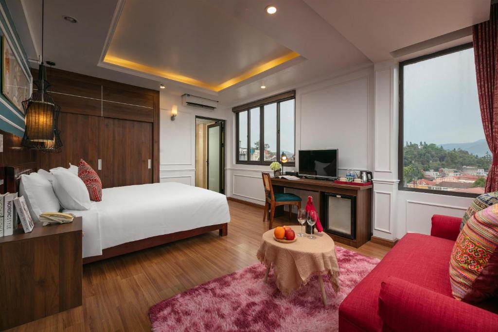Giường trong phòng chung tại Glow Sapa Hotel