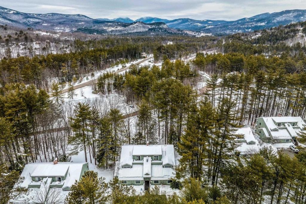 an aerial view of a house in the snow at 1 Mi to Attitash Mountain: Condo w/ Resort Perks in Bartlett