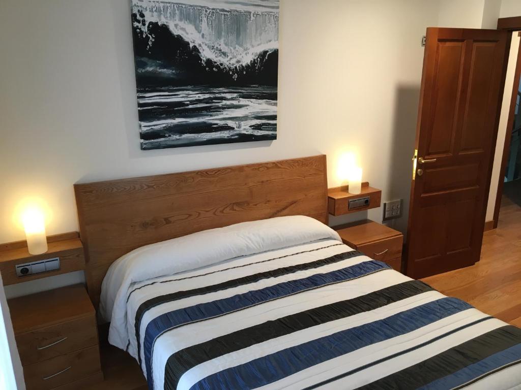 Postel nebo postele na pokoji v ubytování Casa Rural Roncesvalles
