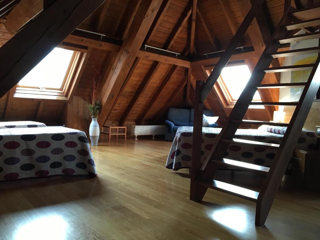 Postel nebo postele na pokoji v ubytování Casa Rural Roncesvalles