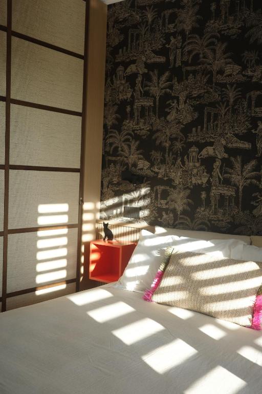 Ένα ή περισσότερα κρεβάτια σε δωμάτιο στο A la plage R