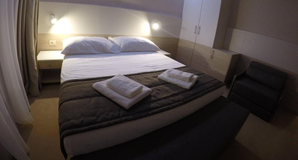 Postel nebo postele na pokoji v ubytování Guest House Neho