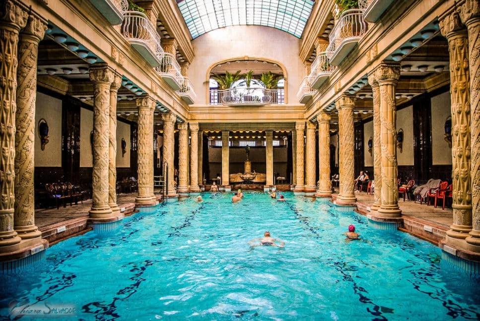 a group of people in a swimming pool in a building at Eden Apartment Budapest in Budapest