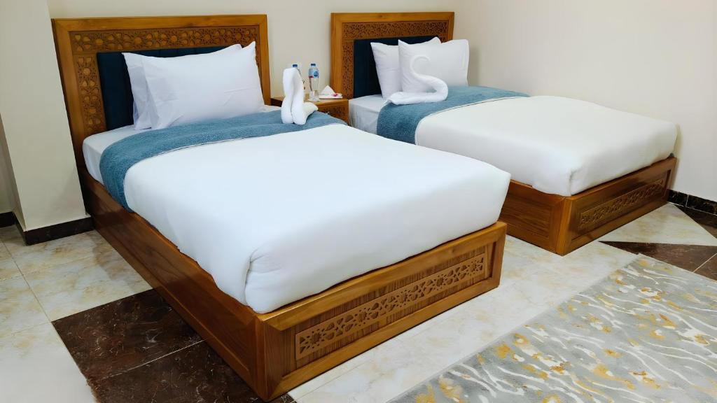 Postel nebo postele na pokoji v ubytování Pharaohs Pyramids Crypt