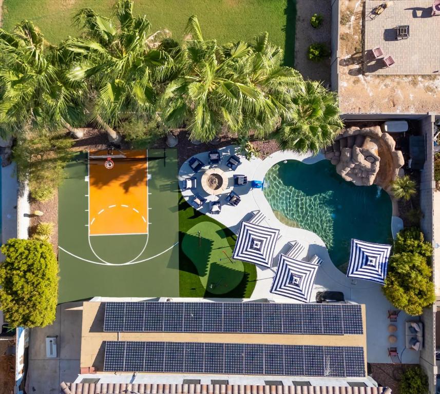 an overhead view of a resort with palm trees at Sleeps 16 Pool Hot Tub Sport Court Game Room in Peoria